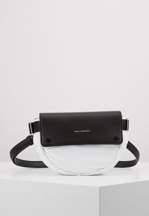 Black leather and white padded fabric bag with a rounded shape, adjustable strap, and silver hardware. Features "KARL LAGERFELD" logo.