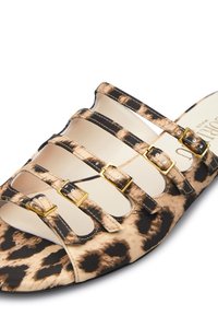 Leopard-print slide sandal with multiple gold-tone buckle accents, open-toe design, and a smooth texture on a neutral background.