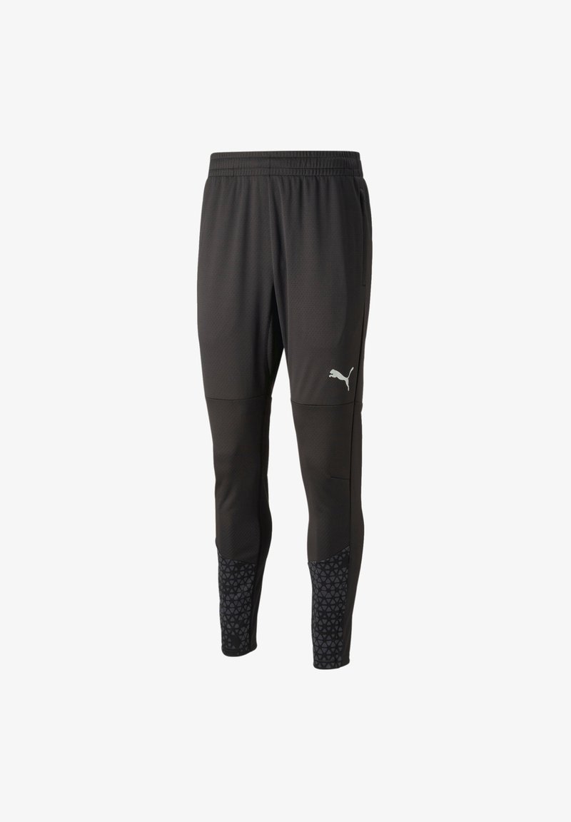 Pantaloni sportivi neri con parte superiore testurizzata, design aderente e risvolti inferiori con motivo. Presentano una vita elastica e tasche laterali.