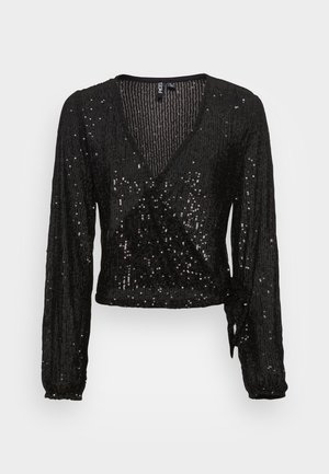 Zwarte wikkel top met lange mouwen en V-hals, bedekt met kleine glanzende pailletten, en een detail met strik aan de zijkant van de taille.