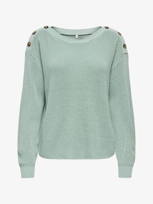 Light green knitted long-sleeve sweater with boat neckline and three brown buttons on each shoulder.