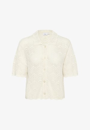 Kurzarm-Cardigan in creme mit einem Strickmuster, das offenes Gewebe und Zickzackdetails aufweist. Frontknopfverschluss mit gewelltem Saum.