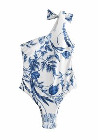 Enbitt baddräkt i vitt med blå blommönster, med en asymmetrisk design och en knytning på axeln. Slät tygtextur.