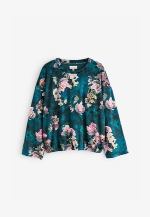 Sweatshirt floral în teal închis, cu flori roz și albe. Mâneci lungi cu tiv elastic și talie ușor strânsă pentru a oferi formă.