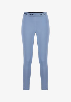 Lichtblauwe, nauwsluitende sportlegging met zwarte elastische tailleband, voorzien van de tekst "TED BAKER SPORT" in wit en zwart.