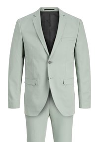 Lys grøn dress laget av glatt stoff; har en en-knapp design, to frontlommer og en svart innvendig foring.