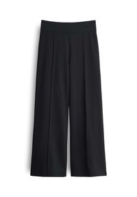 Pantalons larges noirs avec une texture lisse, présentant des plis sur le devant et une taille plate élastique pour un confort et une facilité de port.