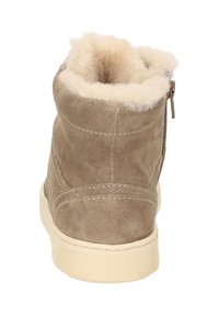 Brown suede ankle boot with a soft, cream-colored faux fur lining. Features a zipper closure on the side and a textured, rubber sole.