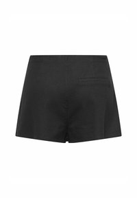 Črne hlače s elegantnim dizajnom, ki vsebujejo zadnji žep in rahlo odprtino na dnu za lažje gibanje. Tkanina je teksturirana.