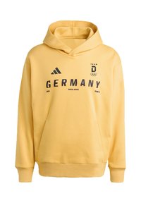 Gelber Kapuzenpullover aus weichem Stoff. Aufschrift „GERMANY“ und „2026 WINTER SPORTS“ in Dunkelblau. Kängurutasche vorne.
