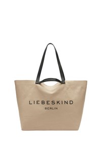 Beige Canvas-Umhängetasche mit schwarzen Ledergriffen. Auf der Vorderseite prangt der markante schwarze Schriftzug "LIEBESKIND BERLIN". Einfaches und geräumiges Design.