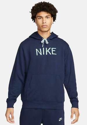Sudadera de marina hecha de mezcla de algodón, con bolsillo frontal y cordón ajustable. Presenta el logo de "NIKE" en verde claro en el pecho.
