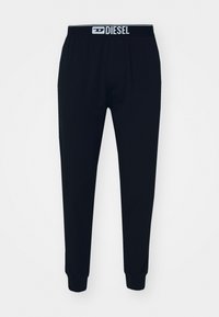 Pantalons de jogging noirs en tissu doux, avec une taille élastique portant le logo "DIESEL", des jambes fuselées et des poignets côtelés.