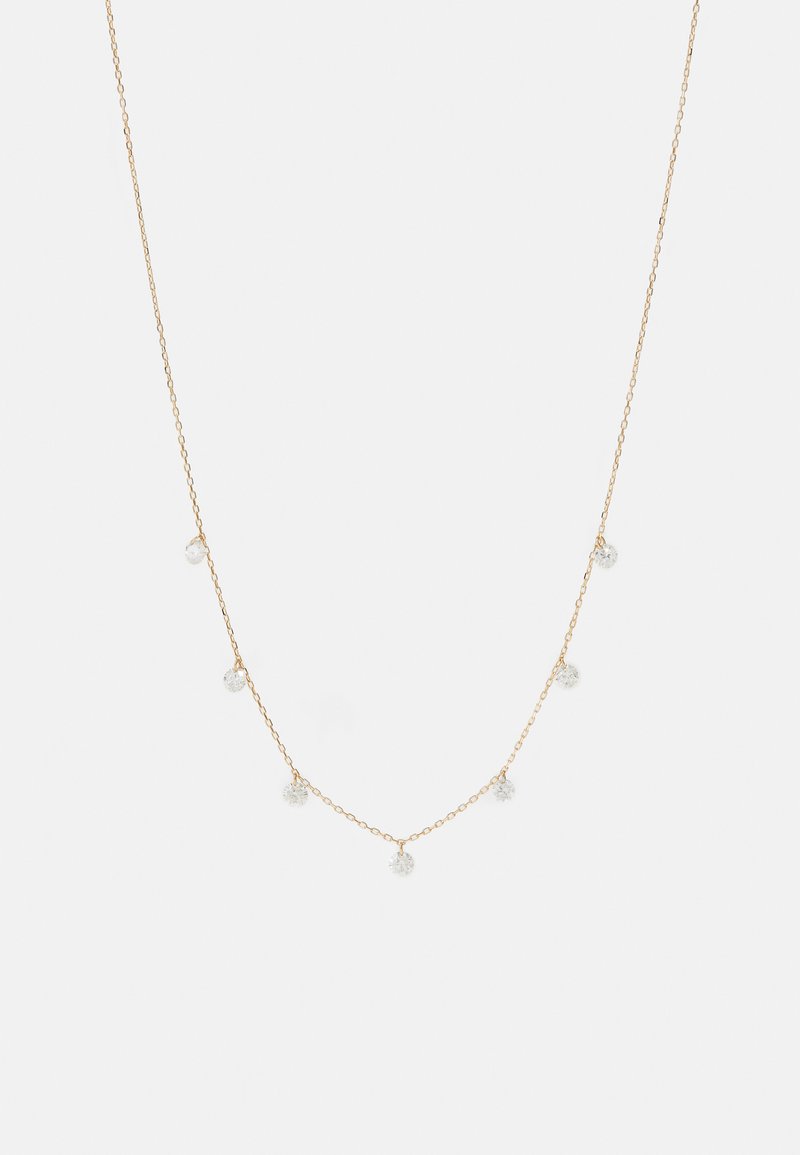 Zelta krāsas kaklarota ar smalku ķēdīti, kas izrotāta ar pieciem maziem, caurspīdīgiem stikla vai kristāla akcentiem, vienmērīgi izvietotiem gar garumu.