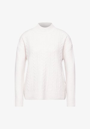 Valkoinen neulepaita, jossa on korkea kaula-aukko, väljä istuvuus ja ribbireunat. Pehmeä texture, jossa on monimutkaisia kudontakuvioita ympäriinsä.