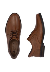 Braune Lederschuhe mit glatter Oberfläche, runder Zehenpartie und kontrastierender dunkler Gummisohle. Verfügen über eine traditionelle Schnürung und subtile Nähte.