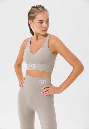 NAIKAN SEAMLESS - Light support sports bra - beige