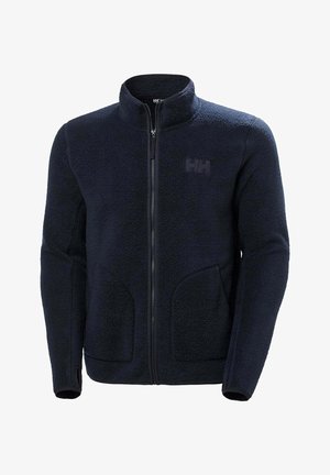 Navy blue fleece jacket with high collar, front zipper, and two side pockets. Has a textured, soft fabric and a subtle logo on the chest.