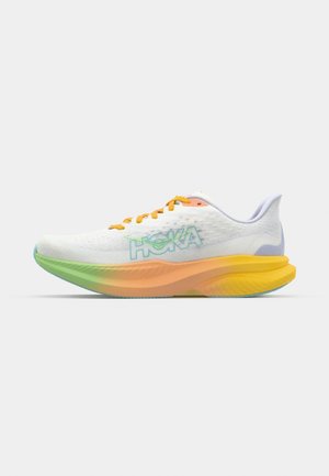 HOKA running shoe featuring a white mesh upper, orange laces, and a multi-colored gradient sole transitioning from green to yellow.