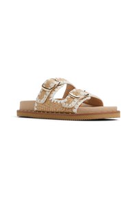 Beige braided sandals with white detailing, featuring two adjustable buckles, a flat sole, and a textured footbed for comfort.