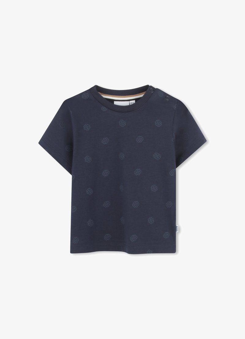 Marineblauwe T-shirt met korte mouwen, gemaakt van katoen met een subtiel patroon van elkaar verbonden vormen. Voorzien van schouderdrukknoopsluiting en een ronde halslijn.