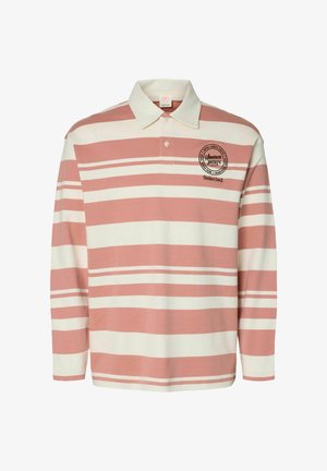 Maillot de rugby à manches longues avec larges rayures horizontales roses et blanches, col blanc, patte de boutonnage, et logo rond avec texte sur la poitrine gauche.