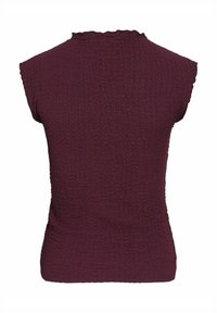 Burgundy ärmlös topp i texturerad, krinklad tyg. Har en scalloped linning och en figurnära design. Ingen synlig hårdvara eller detaljer.