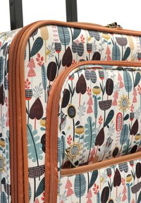 Hard-shell suitcase with a cream background featuring colorful floral and leaf patterns. Brown zipper trim and multiple exterior pockets.