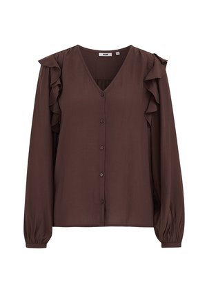 Pruun, pika varrukaga pluus V-kaelusega, ees nupukinnitusega ja õlgadel volangidega. Sile ja kerge kangas mugava lõikega.