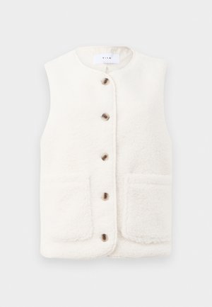 Kremfarget ermeløs vest laget av myk fleece, med rund hals, frontlukking med knapper, og to lommer med klaff.