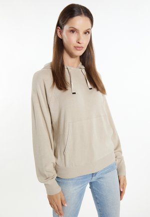 Hoodie bej, ușor, cu un buzunar tip kangaroo, glugă cu șnur și manșete ribbate. Textură netedă, croială lejeră și mâneci lungi.