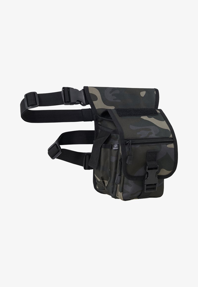 Kamo tipo naudingumo krepšys su reguliuojamais juodais diržais ir keliais skyreliais. Yra užklotas su Velcro uždarymu ir priekinis užtrauktuku uždaromas kišenė.