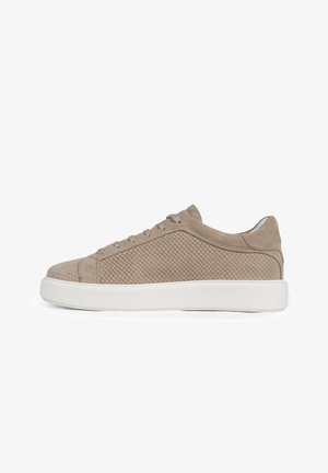 Beige suede sneaker with textured side panels, lace-up front, and thick white rubber sole, shown from the side on a white background.