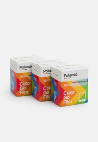 Three boxes of Polaroid Color Go Film, white packaging featuring bright, geometric patterns in rainbow colors, labeled for 16 instant photos.