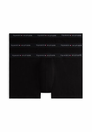 Tres pares de calzoncillos bóxer negros de Tommy Hilfiger con cinturillas elásticas con la marca, apilados planos sobre un fondo blanco.