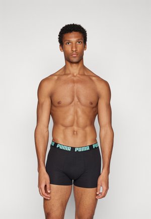 Black boxer shorts with a light blue PUMA logo waistband. Features a snug fit and soft texture, suitable for everyday wear.