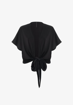 Blusa nera corta realizzata in tessuto morbido, con maniche corte, chiusura anteriore con nodo e design aperto sul davanti.
