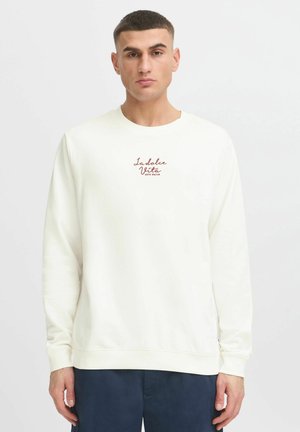 White crewneck sweatshirt in soft cotton, featuring a small red printed text "La dolce Vista" on the chest. Ribbed cuffs and hem.