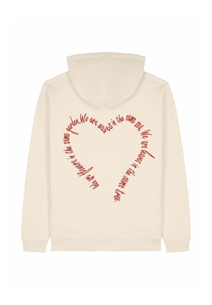 Hoodie crème avec un design de cœur rouge formé par du texte courbé au dos. Équipé d'une capuche avec cordon de serrage et de poignets côtelés aux manches.