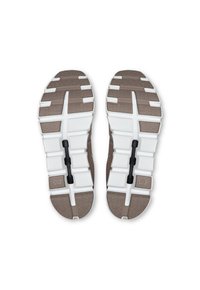 Brown and white athletic shoe soles feature a segmented design with textured patterns, grooves for traction, and a central black structural element.