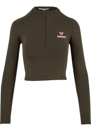 Long-sleeve cropped top in dark green fabric, featuring a high neck and a front zipper. "Delicious" logo in light pink on the left chest area.