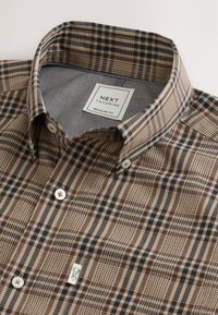 Brown and beige checkered button-up shirt with white buttons, button-down collar, and an inside label reading "NEXT Tailoring Regular Fit."