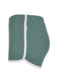Green athletic shorts with white trim, elastic waistband, and a small tag with a leaf icon on the side.