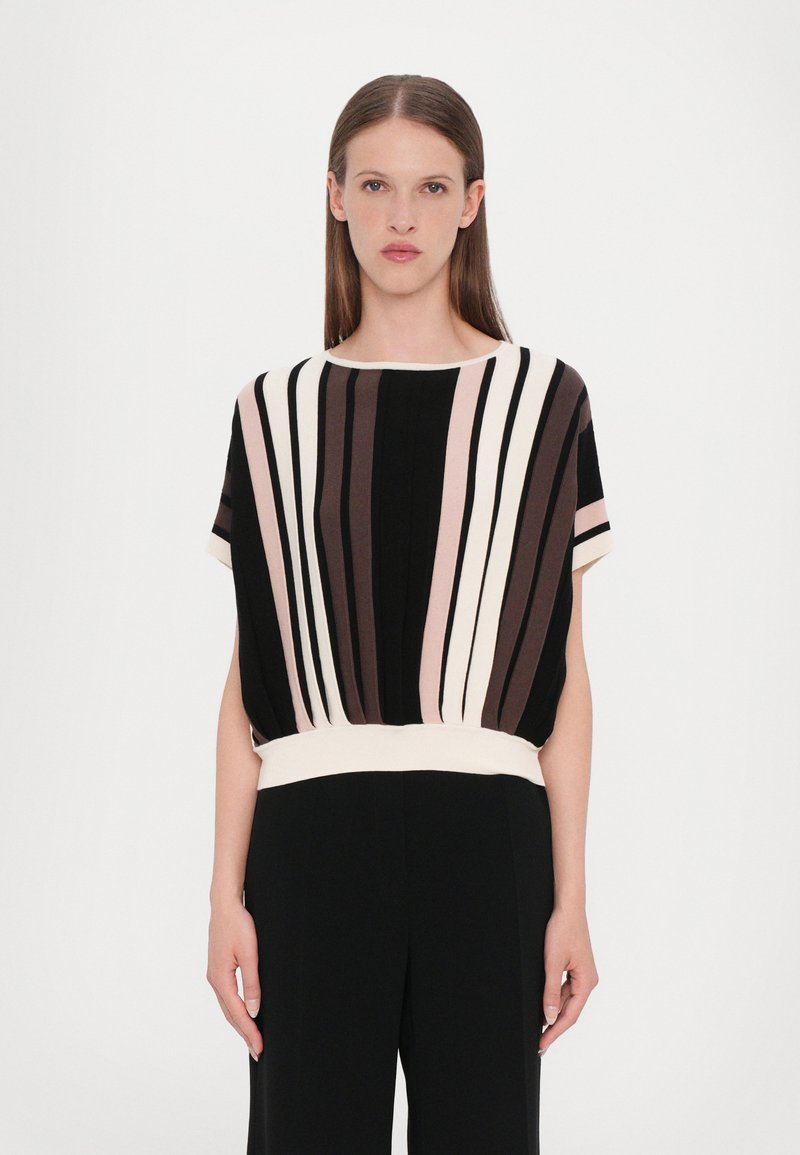 Short-sleeve top featuring vertical stripes in black, pink, and brown, with a soft white band at the waist for a relaxed fit.