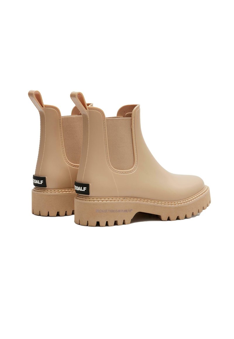 Botas Chelsea de goma marrón con paneles laterales elásticos, lengüetas de tiro y suelas gruesas y robustas. El diseño cuenta con una textura suave y un sutil detalle del logo.