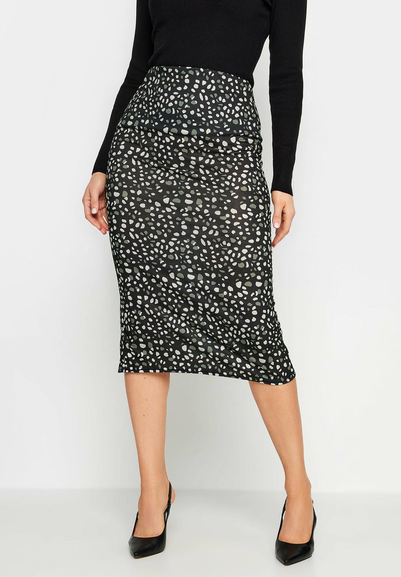 Mustat kynähame, joka esittelee teksturoidun designin epäsäännöllisillä valkoisilla ja harmailla pilkuilla. Korkea vyötärö, puolipitkä ja joustava kangas.