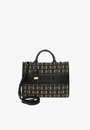 Zwarte en beige tas gemaakt van stof en leer met een herhalend logo-patroon, bovenhandvatten en een afneembare schouderband. Gouden accenten.