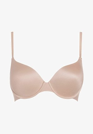 Beige gevormde beha met verstelbare bandjes, een gladde textuur en een naadloos ontwerp. Beschikt over een subtiele glans en een centrale naad voor ondersteuning.