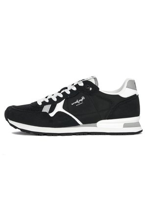 Black and white low-top sneaker with white laces, mesh and suede panels, and branded detail on the side and tongue.