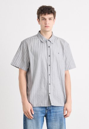 Grey short-sleeve button-up shirt featuring vertical stripes, a pointed collar, and logo detail on the chest. Material appears lightweight and smooth.